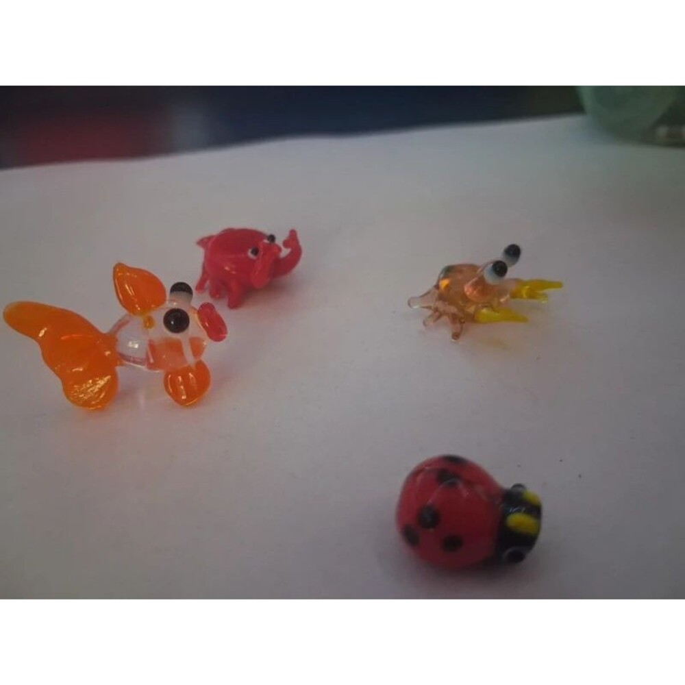 4 miniature glass figurines